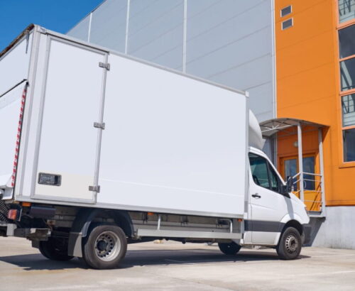 lorry-standing-outdoors-near-warehouse-2-min