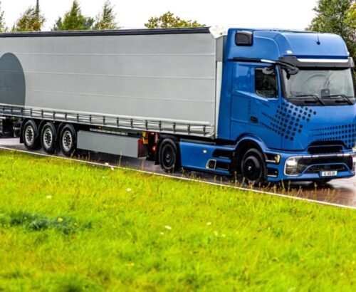 modern-blue-truck-wet-highway-power-reliability-motion-2